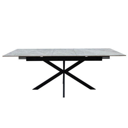 Rectangular table with a tiled top and black metal frame on a white background