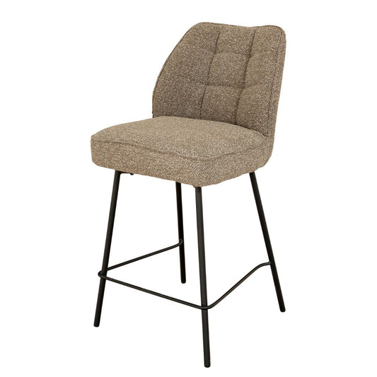 Brown bar stool with quilted backrest on a white background