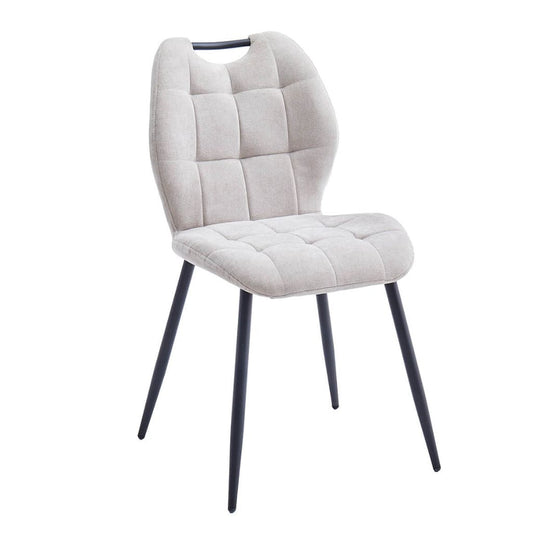 Beige upholstered chair with black legs on a white background