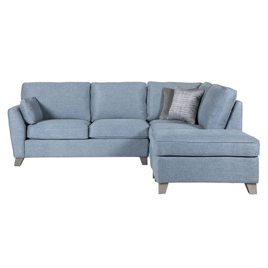 Blue sectional sofa with cushions on a white background