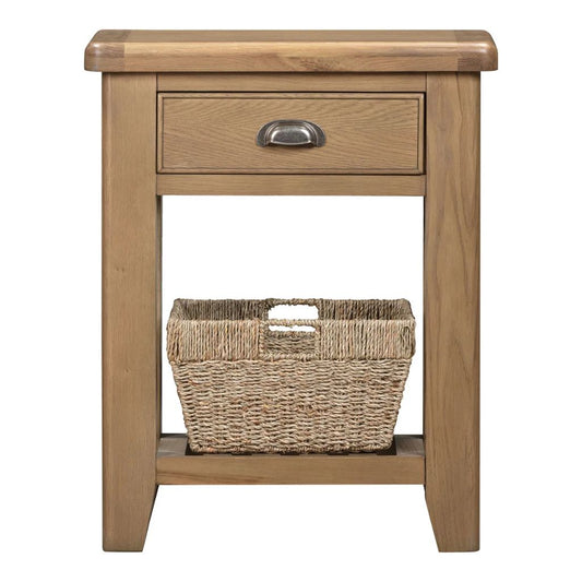 Wooden side table with a drawer and a woven basket on a white background