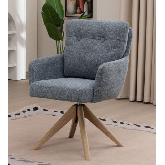 Blue upholstered chair with wooden legs in a room setting