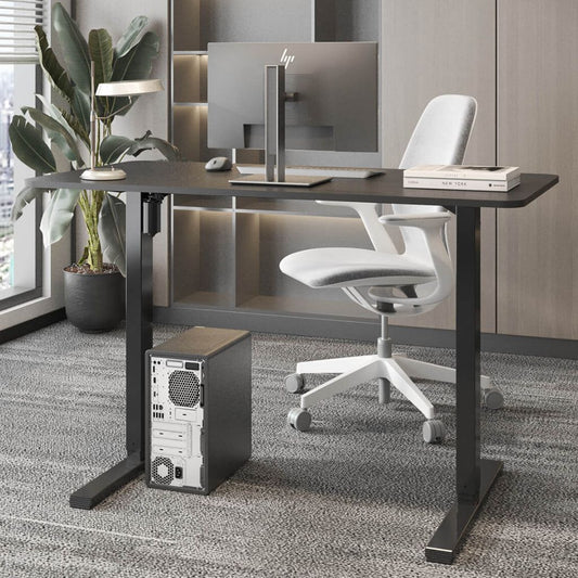 Modern office desk setup with HP computer monitor, chair, and plant.