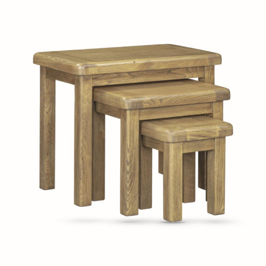 Set of three wooden nesting tables on a white background