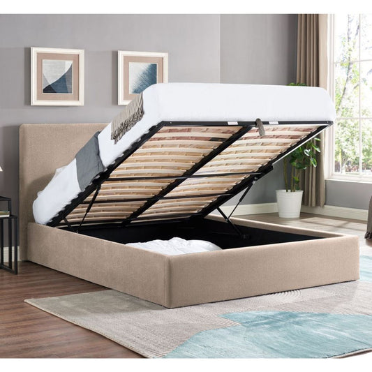 Beige upholstered bed with open storage compartment in a room with gray walls and a window.