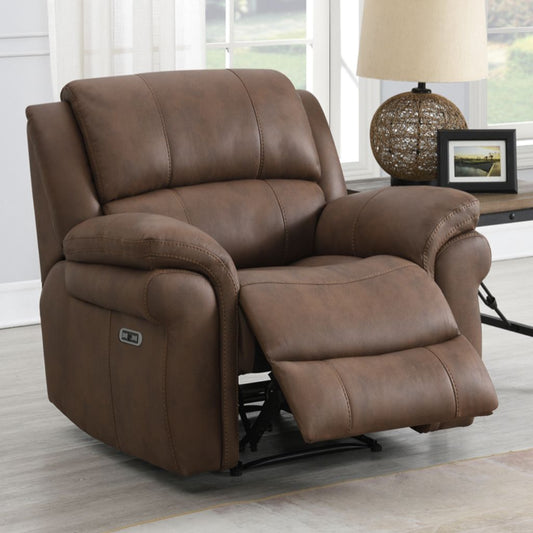 Brown fabric recliner chair in a living room setting with a lamp and window in the background.