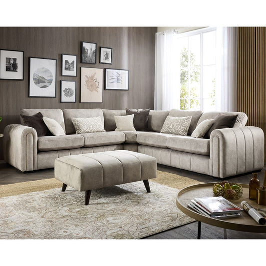 A beige fabric sofa set with plush cushions, featuring elegant lines and gold piping.