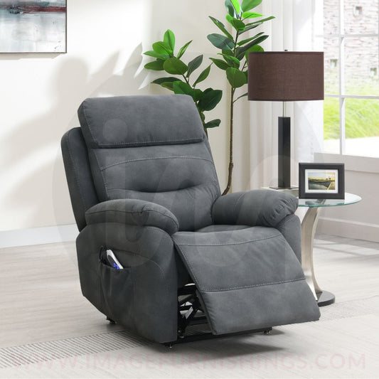 Gray recliner chair in a living room setting with a plant and table lamp.