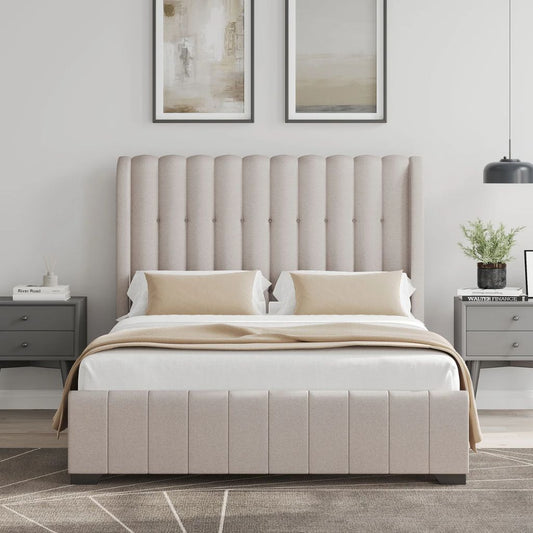 Beige upholstered bed in a bedroom setting with side tables and artwork on the wall.