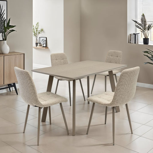 Dining room with a beige table and chairs in a modern interior setting.