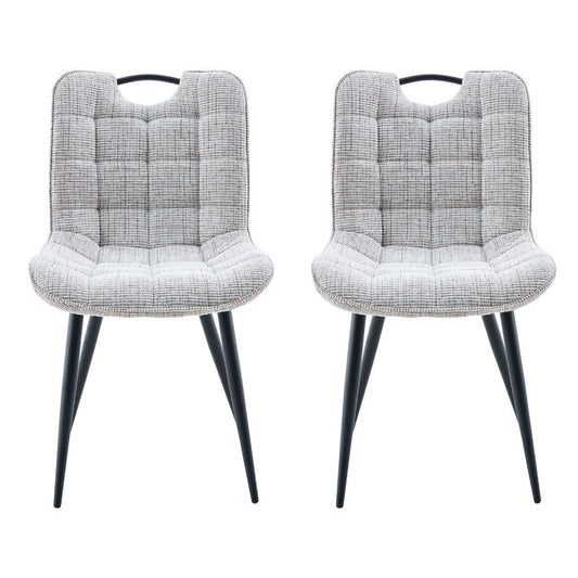 Two biscuit cushioned chairs with black legs on a white background