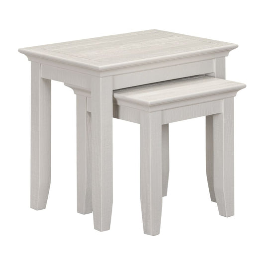 Set of two beige nesting tables on a white background