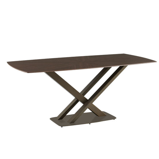 Dining table with a unique X-shaped metal base on a white background