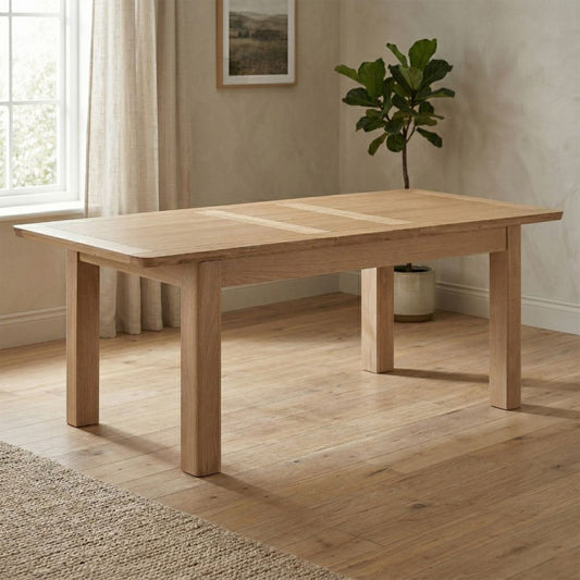 Light oak wooden dining table with extending feature
