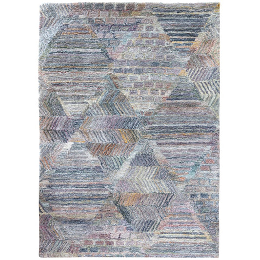 Multicolored geometric patterned rug on a white background
