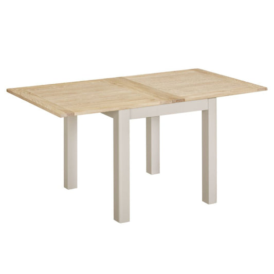 Wooden dining table with white legs on a white background