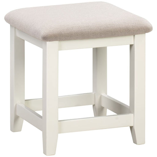 Ivory stool with a beige cushioned seat on a white background