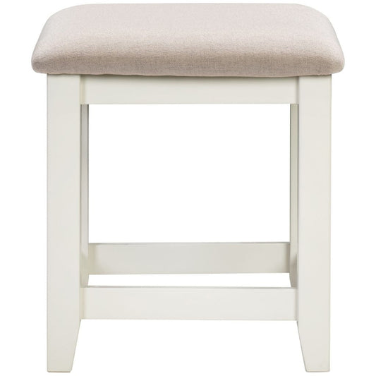 Ivory stool with a beige cushioned seat on a white background