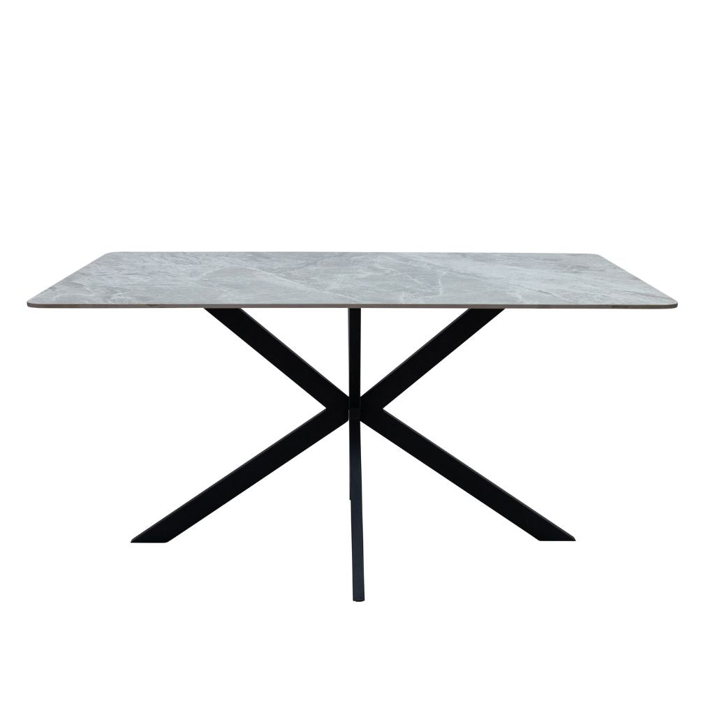 Dining table with marble-like top and black metal legs on a white background