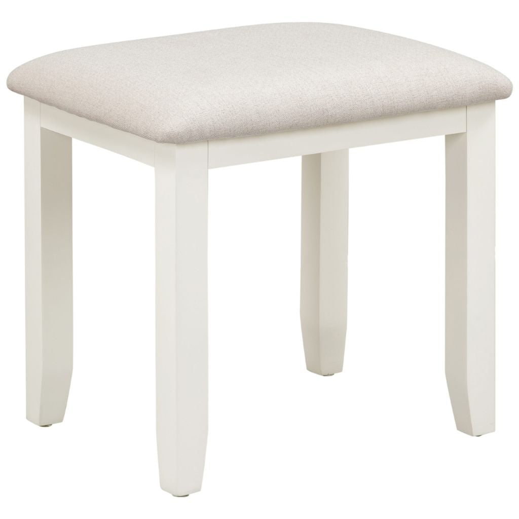 Ivory stool with a light oat cushion on a white background