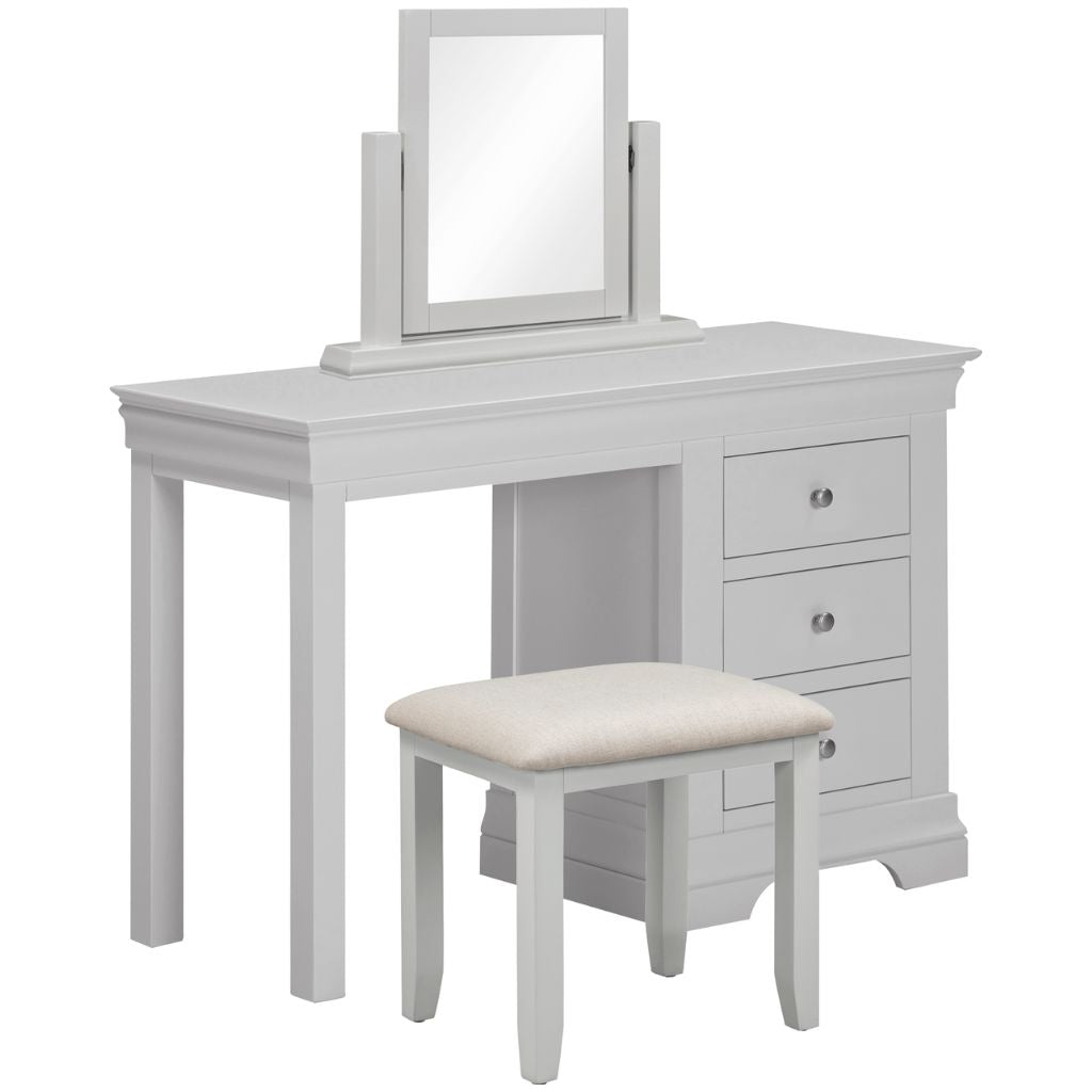 Grey vanity table with mirror and stool on a white background