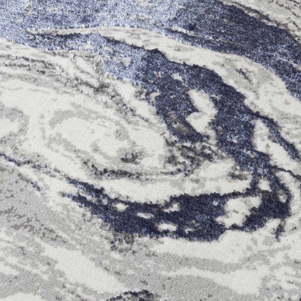 Close-up of a swirling pattern in blue and gray