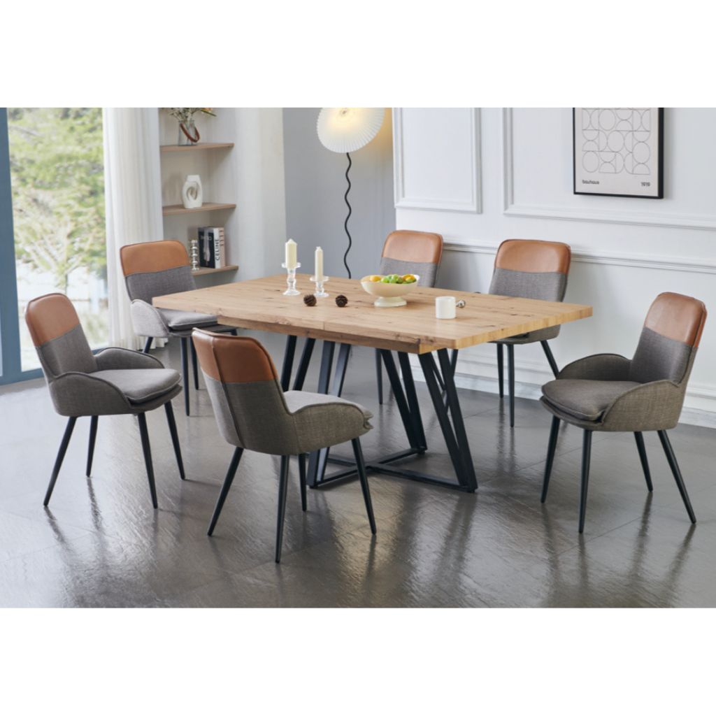 Dining room with a wooden table and chairs in a modern interior setting.