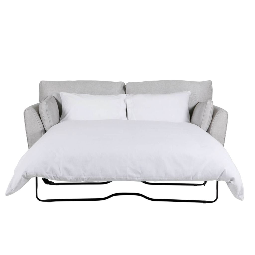 A light grey upholstered sofa bed showing just how comfortable and cosy it can be.