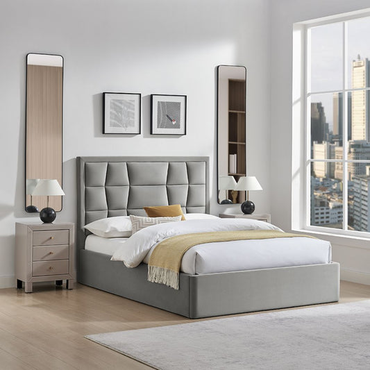 Modern bedroom with a gray upholstered bed, nightstands, and cityscape view.