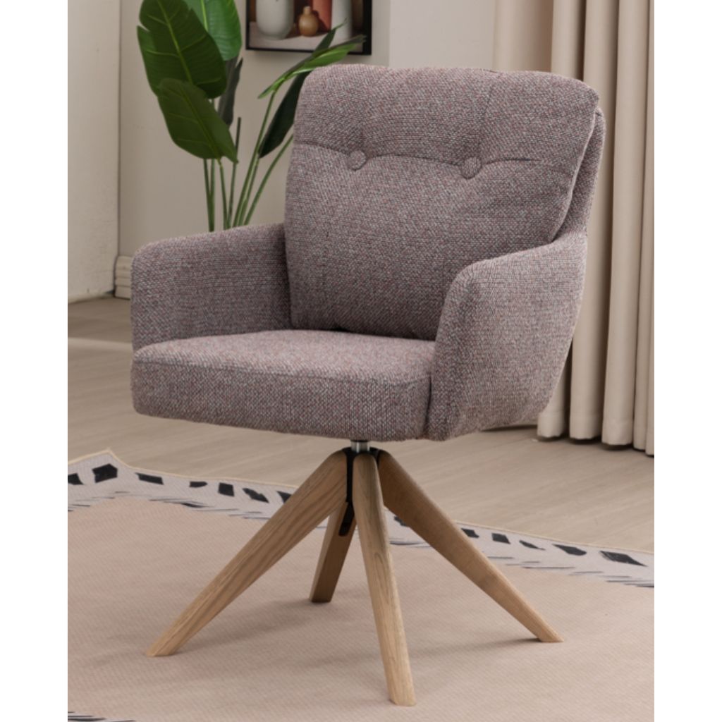 Blush granite armchair with wooden legs in a room setting