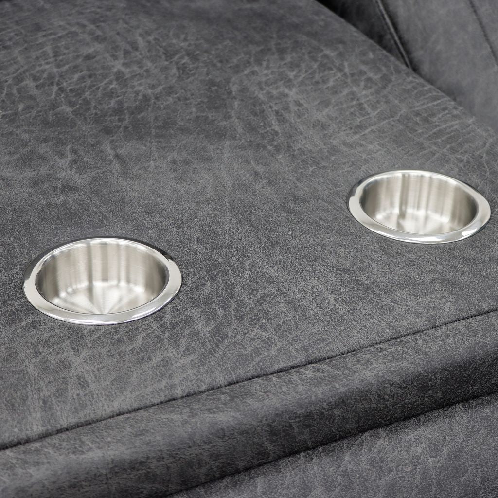 Two silver cup holders on a gray textured surface