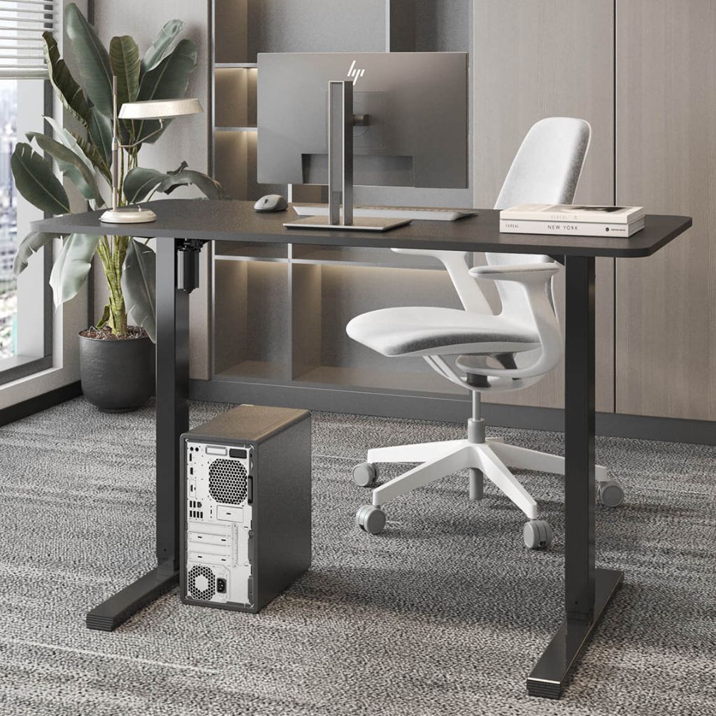 Modern office desk setup with HP computer monitor, chair, and plant.