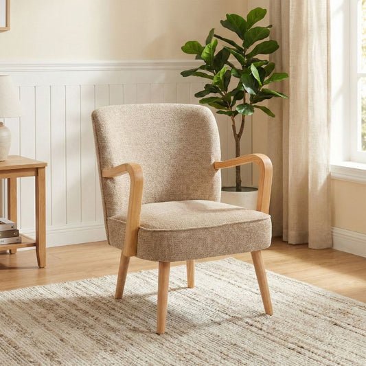 Beige armchair in a room with a plant and window