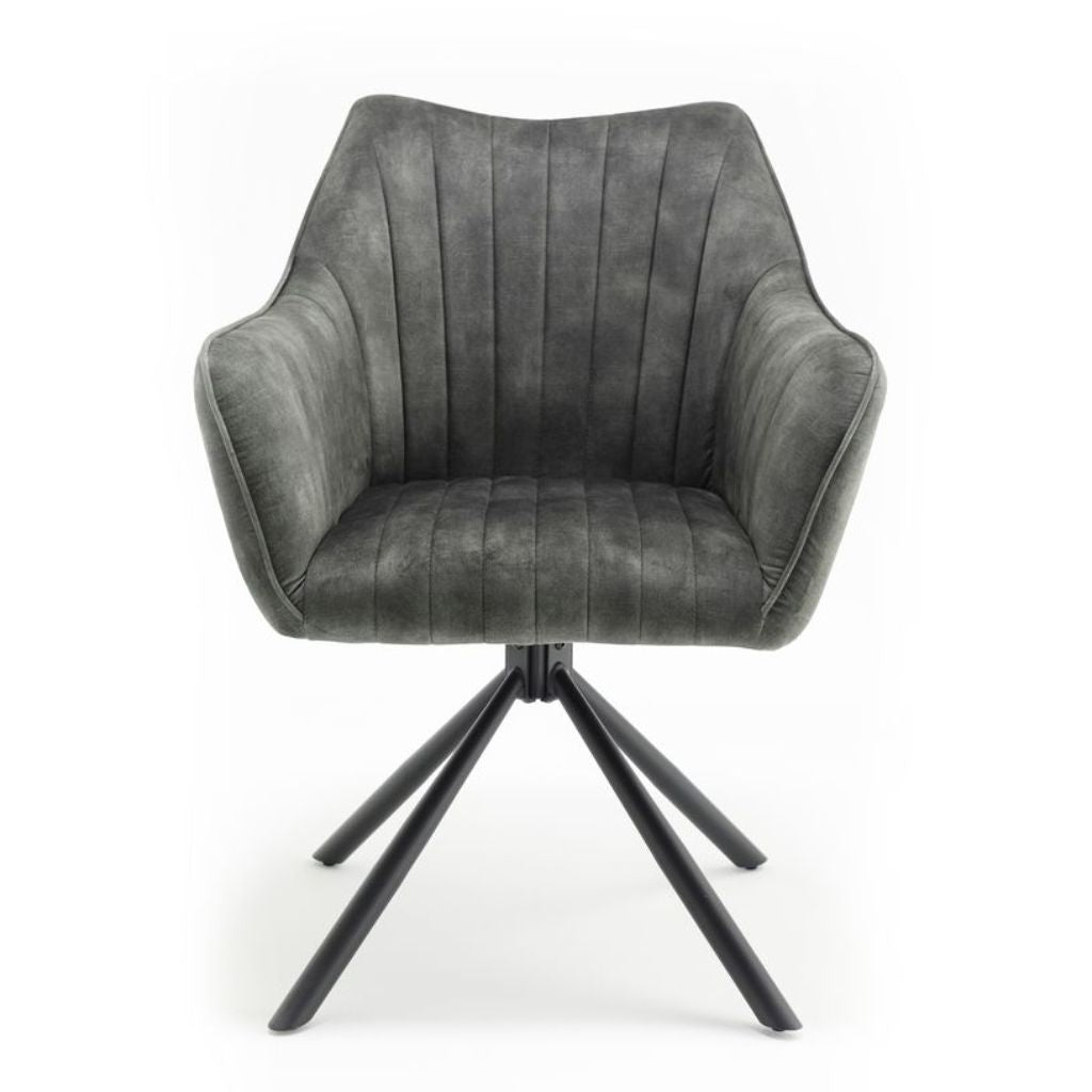 Green upholstered chair with black metal base on a white background