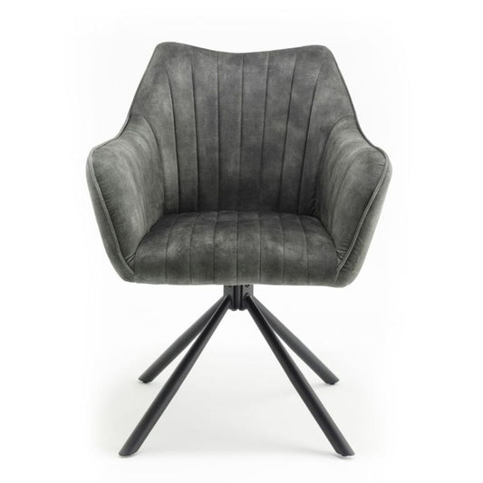 Green upholstered chair with black metal base on a white background