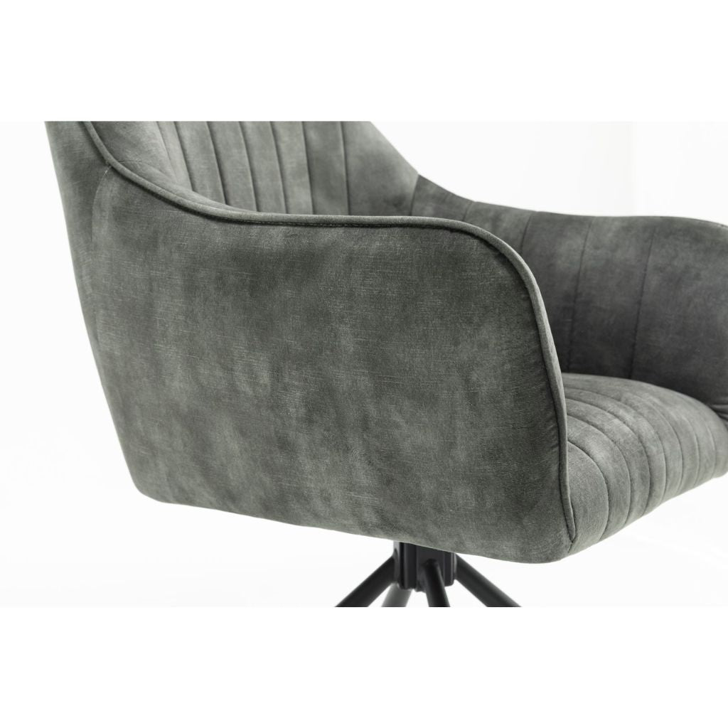Green upholstered chair with a white background