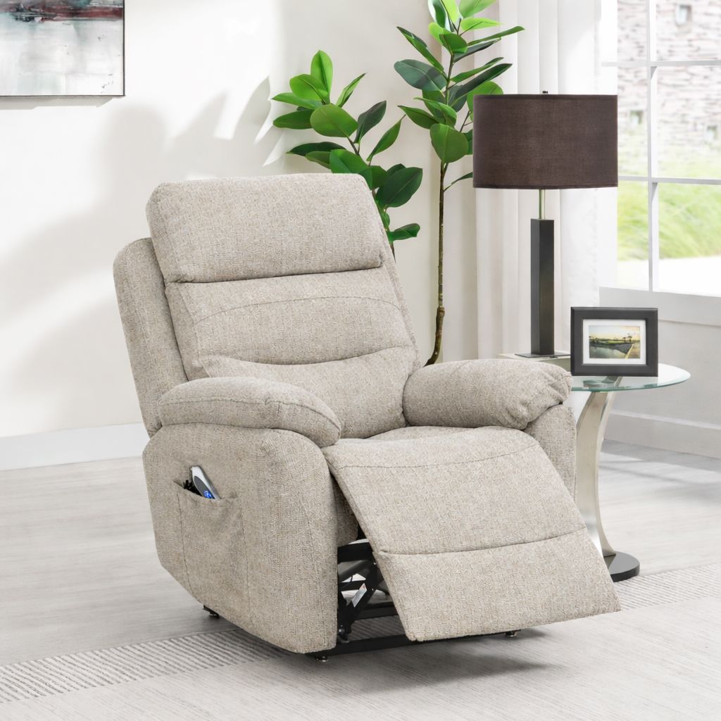 Beige recliner chair in a living room setting with a plant and table lamp.