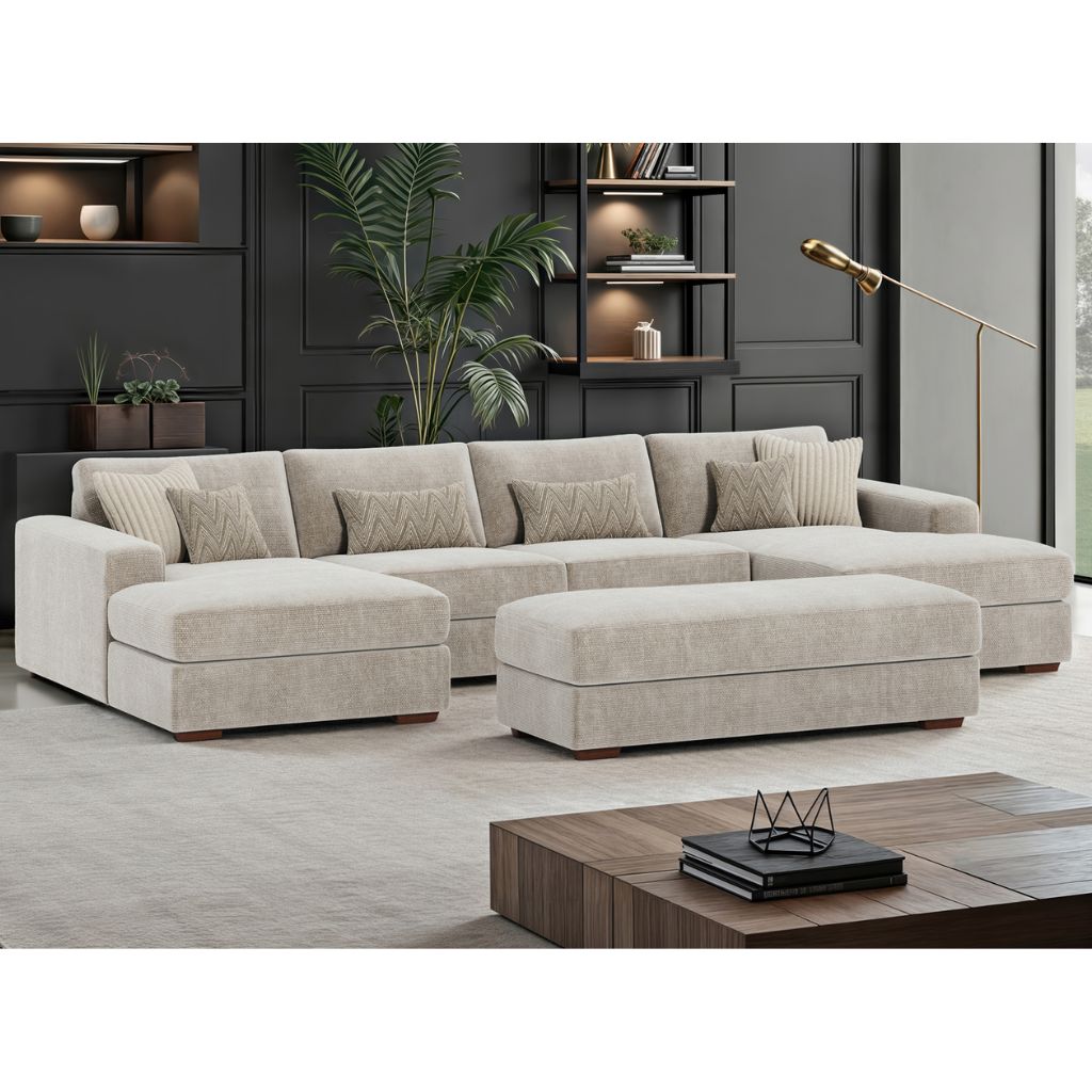 Beige sectional sofa in a modern living room setting with shelves and decor.