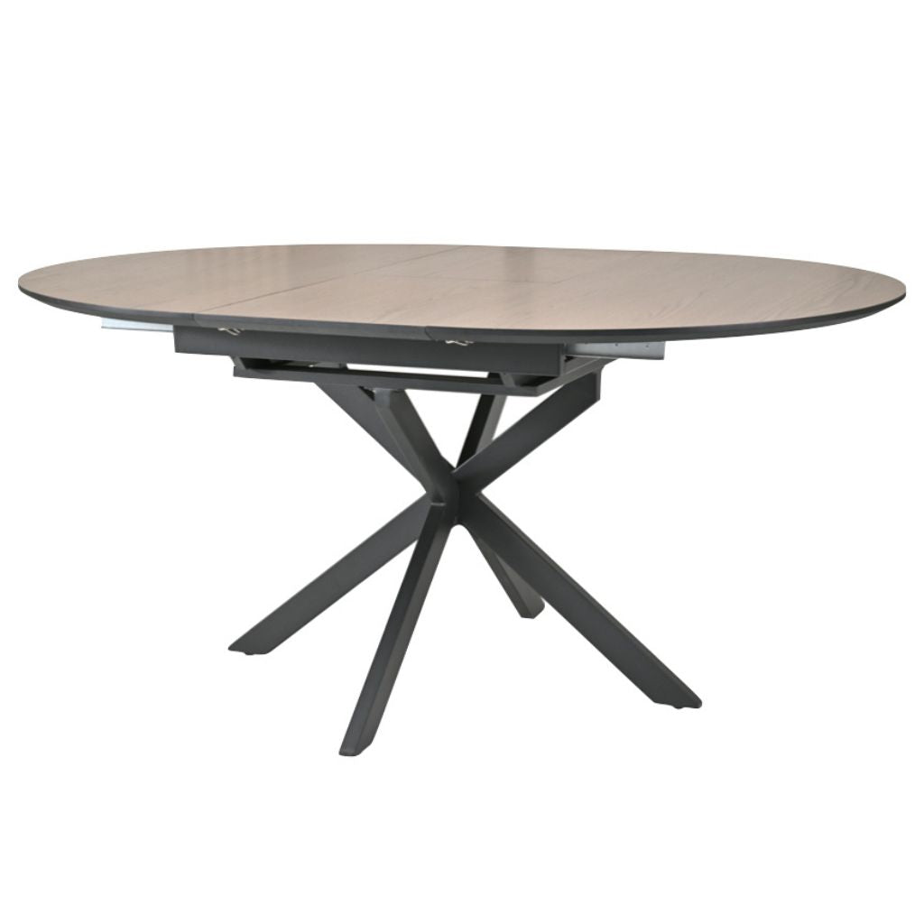 Round dining table with a oak top and black metal base on a white background