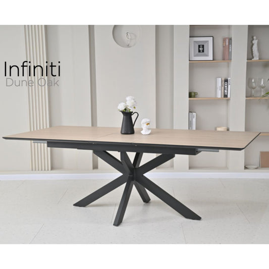 Dining table with black metal legs in a modern interior setting, featuring the brand 'Infiniti'.