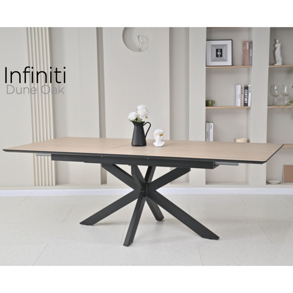 Dining table with black metal legs in a modern interior setting, featuring the brand 'Infiniti'.