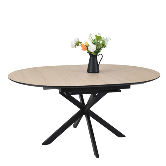 Round wooden table with black metal legs on a white background