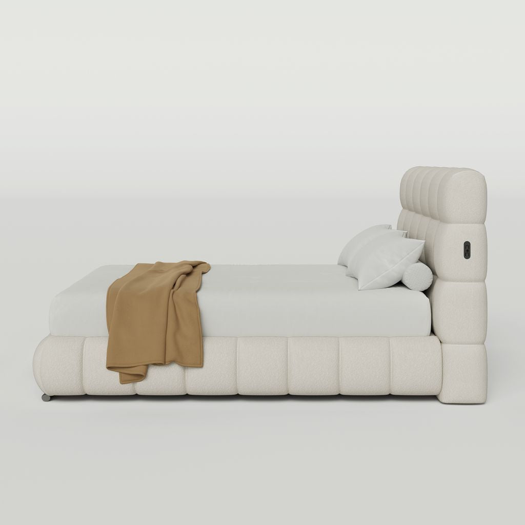 Modern beige bed with a white mattress and brown blanket on a white background