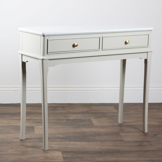 Stone console table with two drawers on a wooden floor.