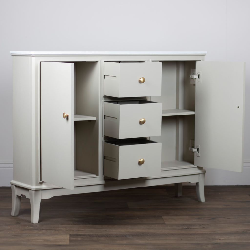 Stone cabinet with open doors and drawers on a wooden floor.
