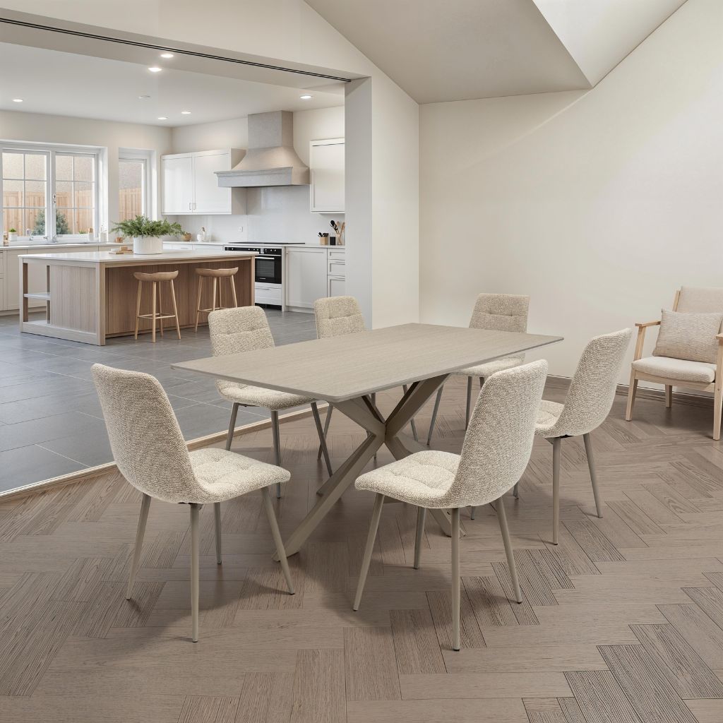 Modern kitchen and dining area with a table and chairs.