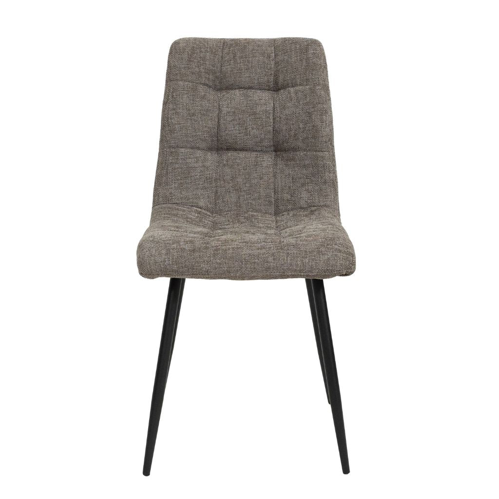 Beige upholstered chair with black legs on a white background