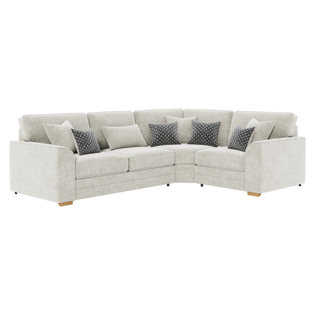 Natural sectional sofa with patterned cushions on a white background