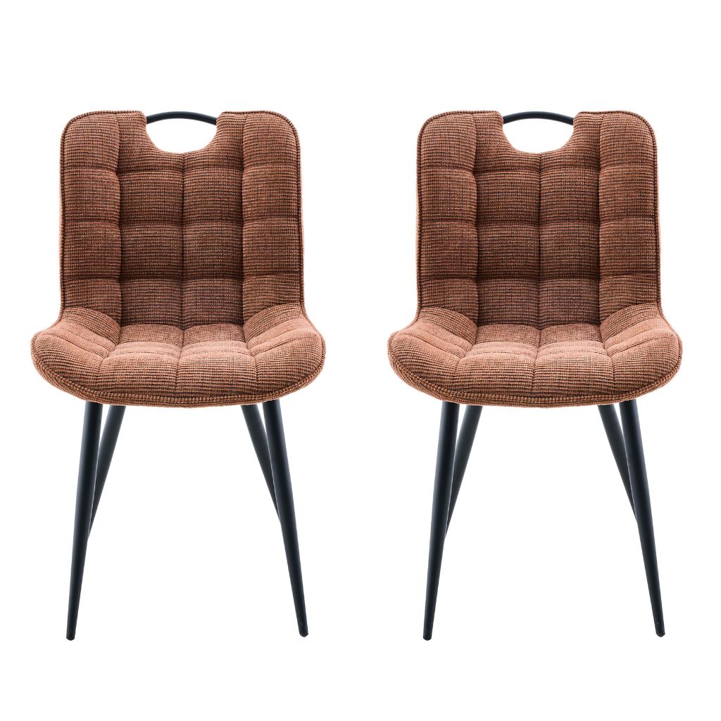 Two rust upholstered chairs with black legs on a white background