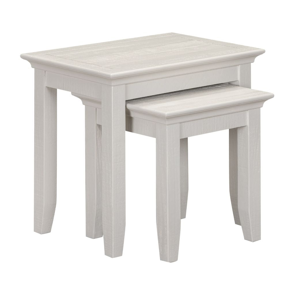 Set of two beige nesting tables on a white background